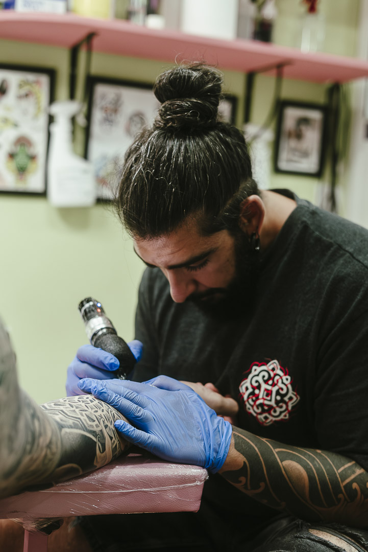 BOGA tattoo artist Martin González working on professional blackwork tattoo in Oakland California studio